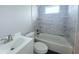 Bathroom with a tiled shower-tub combo and modern vanity at 3329 Roxbury Dr, Holiday, FL 34691