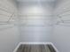 Walk-in closet with wood floors and coated wire shelving at 3329 Roxbury Dr, Holiday, FL 34691
