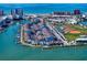 A scenic view of waterfront homes with boat docks, tennis court, baseball field and waterfront access at 343 Rex Pl # G, Madeira Beach, FL 33708
