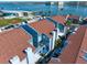 An aerial view shows the condo buildings in a community along the waterfront at 343 Rex Pl # G, Madeira Beach, FL 33708