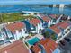 A high angle shows a waterfront condominium complex with swimming pool and beautiful water views at 343 Rex Pl # G, Madeira Beach, FL 33708