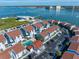 High angle view of waterfront condominium complex with community swimming pool and water access at 343 Rex Pl # G, Madeira Beach, FL 33708