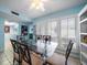 Bright dining room with a glass table, seating for six, and plenty of natural light at 343 Rex Pl # G, Madeira Beach, FL 33708