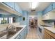 The kitchen has an opening to the dining room, offering a seamless transition for entertaining at 343 Rex Pl # G, Madeira Beach, FL 33708