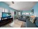 Light and airy living room with coastal decor and comfortable seating at 343 Rex Pl # G, Madeira Beach, FL 33708