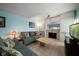 Cozy living room with a fireplace and comfortable seating arrangement at 343 Rex Pl # G, Madeira Beach, FL 33708
