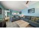 Open-concept living room with tile floors and bright, airy decor at 343 Rex Pl # G, Madeira Beach, FL 33708