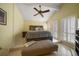 Bedroom with high ceilings, shuttered french doors, and tiled floors at 343 Rex Pl # G, Madeira Beach, FL 33708