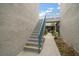 An exterior stairway gives access to upper level units at 343 Rex Pl # G, Madeira Beach, FL 33708