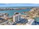 Breathtaking aerial view of the coastal condo complex and surrounding waterways at 400 Island Way # 201, Clearwater Beach, FL 33767