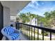 Private balcony with comfortable seating offers peaceful views of the community's serene surroundings at 400 Island Way # 201, Clearwater Beach, FL 33767