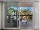 Balcony with seating and peaceful neighborhood view at 400 Island Way # 201, Clearwater Beach, FL 33767