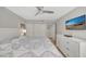 Bright bedroom features a large closet, dresser, and contemporary design at 400 Island Way # 201, Clearwater Beach, FL 33767