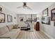 Versatile bedroom or office space with a sofa, treadmill, and wall decor, ideal for a home gym at 400 Island Way # 201, Clearwater Beach, FL 33767
