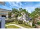 Exterior of a building with green space and manicured landscaping at 400 Island Way # 201, Clearwater Beach, FL 33767