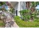 Exterior walkway surrounded by lush landscaping at 400 Island Way # 201, Clearwater Beach, FL 33767