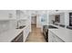 Bright modern kitchen features stainless appliances, quartz counters and breakfast bar with seating at 400 Island Way # 201, Clearwater Beach, FL 33767