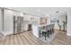 Bright modern kitchen features stainless appliances, quartz counters and breakfast bar with seating at 400 Island Way # 201, Clearwater Beach, FL 33767