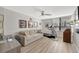 Bright living room with neutral walls and treadmill at 400 Island Way # 201, Clearwater Beach, FL 33767