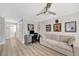 Versatile office space with contemporary desk, comfortable sofa, and ample wall decorations at 400 Island Way # 201, Clearwater Beach, FL 33767