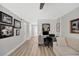 Spacious office area with built-in desk, comfortable seating, and modern decor at 400 Island Way # 201, Clearwater Beach, FL 33767