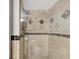 Modern tiled shower features upscale tile design and a clear glass enclosure at 400 Island Way # 201, Clearwater Beach, FL 33767