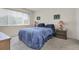 Comfortable bedroom with a large window and coordinated furnishings at 4027 Davit Dr, New Port Richey, FL 34652