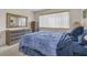 Comfortable bedroom with dresser, mirror, and soft carpeting at 4027 Davit Dr, New Port Richey, FL 34652
