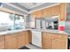 Kitchen with granite counters, stainless appliances and view of community spaces at 4027 Davit Dr, New Port Richey, FL 34652