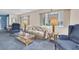 Comfortable living room with plush carpeting, stylish furnishings, and natural light at 4027 Davit Dr, New Port Richey, FL 34652