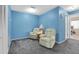 Relaxing living room with two comfortable recliners and soft gray carpeting at 4027 Davit Dr, New Port Richey, FL 34652