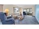 Cozy living room with plush carpeting, comfortable furnishings, and natural light at 4027 Davit Dr, New Port Richey, FL 34652