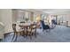 Open living area with plush carpeting, cozy seating, and views of the community at 4027 Davit Dr, New Port Richey, FL 34652