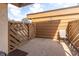 Private outdoor patio space with a wooden fence, chair, and concrete flooring at 4027 Davit Dr, New Port Richey, FL 34652