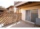 Inviting patio with wood privacy fencing, sliding glass door, and a comfortable outdoor chair at 4027 Davit Dr, New Port Richey, FL 34652