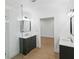 Beautiful bathroom boasts glass shower, dual vanities, and updated finishes at 445 33Rd N Ave, St Petersburg, FL 33704