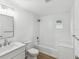 Stylish bathroom featuring a tub, shower, and tiled walls at 445 33Rd N Ave, St Petersburg, FL 33704