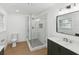 Modern bathroom with a large glass shower, updated vanity and fixtures at 445 33Rd N Ave, St Petersburg, FL 33704