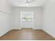 Bright bedroom with wood floors, white walls, and a ceiling fan at 445 33Rd N Ave, St Petersburg, FL 33704