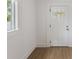 Bright entryway featuring wood floors, fresh paint, and a window at 445 33Rd N Ave, St Petersburg, FL 33704