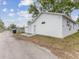 Detached garage with door and side yard, offering potential for various uses at 445 33Rd N Ave, St Petersburg, FL 33704