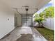 Attached garage with room for parking and storage, plus a bit of greenery at 445 33Rd N Ave, St Petersburg, FL 33704
