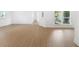 Spacious living room featuring beautiful wood floors and large windows that provide natural light at 445 33Rd N Ave, St Petersburg, FL 33704