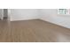 Bright, expansive living room featuring stylish wood flooring and pristine white walls at 445 33Rd N Ave, St Petersburg, FL 33704