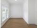 Neutral living room with luxury vinyl plank flooring, natural light, and clean, simple design at 445 33Rd N Ave, St Petersburg, FL 33704