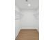 Empty walk-in closet with wood flooring and white shelving at 445 33Rd N Ave, St Petersburg, FL 33704