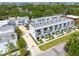 Aerial view showcases modern townhomes with balconies, complemented by lush landscaping, creating a desirable living environment at 4515 W North A St # 8, Tampa, FL 33609