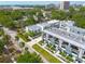 Stunning aerial perspective of contemporary townhomes, surrounded by mature trees and lush greenery at 4515 W North A St # 8, Tampa, FL 33609