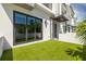Modern home with artificial turf backyard, ideal for relaxing and entertaining outdoors at 4515 W North A St # 8, Tampa, FL 33609