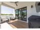 Outdoor balcony area with seating, television, and grill at 4515 W North A St # 8, Tampa, FL 33609